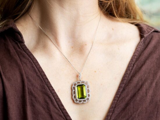 wearing a large peridot pendant