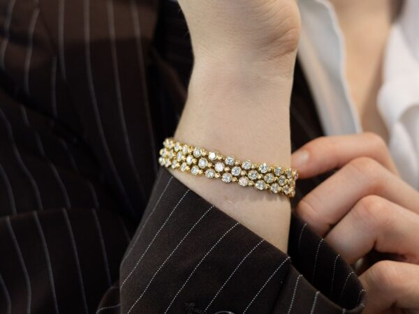 wearing a vintage yellow gold diamond bracelet