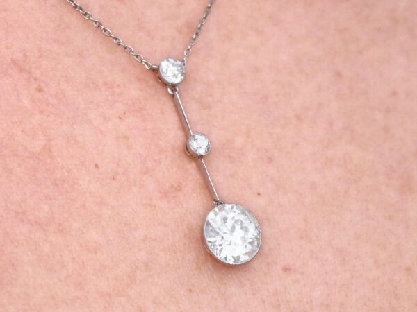 wearing platinum 3 diamond drop pendant necklace