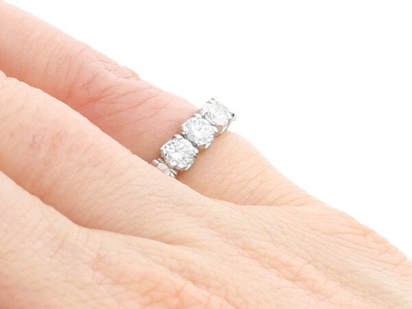 18ct white gold half eternity ring on finger