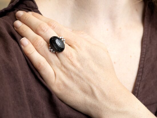 wearing a black onys cabochon ring