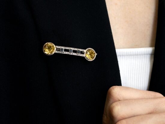 wearing a citrine and onyx brooch