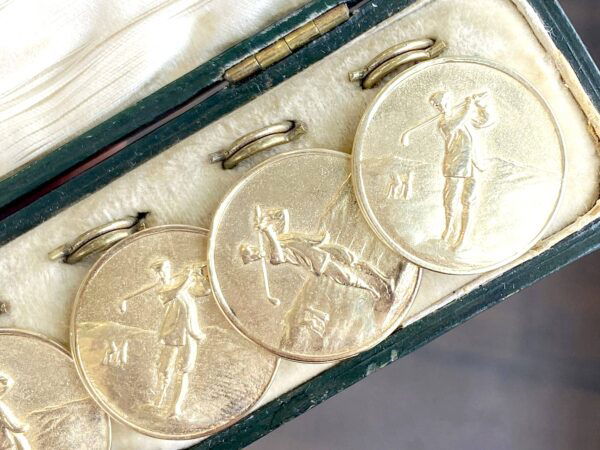 gold golf buttons in box