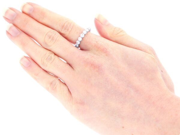 platinum eternity diamond ring on hand