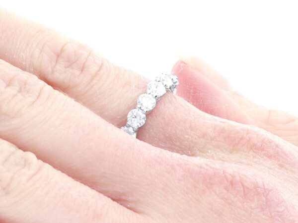 platinum eternity diamond ring on finger