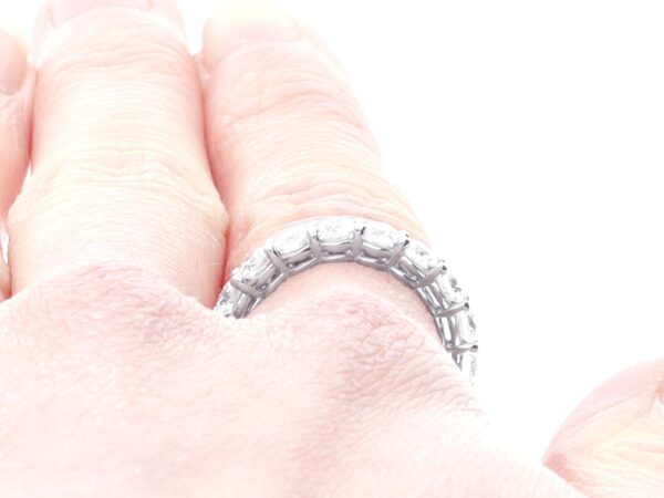 wearing a platinum eternity diamond ring