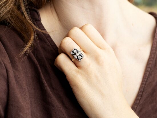 wearing gold onyx ring with diamonds
