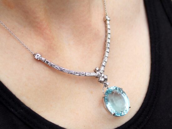 Diamond Necklace with Aquamarine Pendant being worn