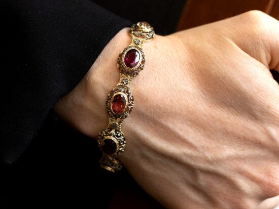 wearing garnet and citrine gold bracelet