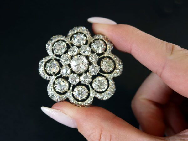 Victorian diamond brooch being held