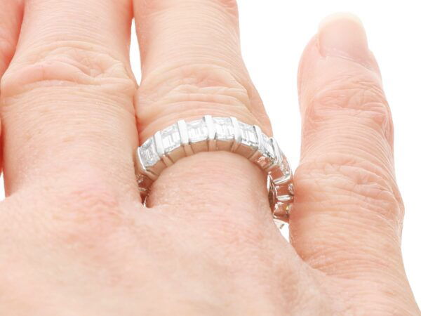 emerald cut diamond eternity ring on hand