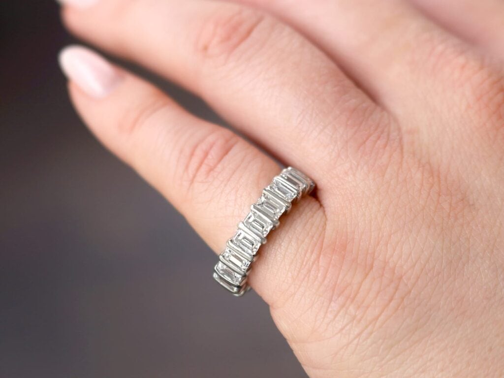 wearing emerald cut diamond eternity ring