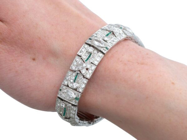 1920s emerald diamond bracelet on wrist