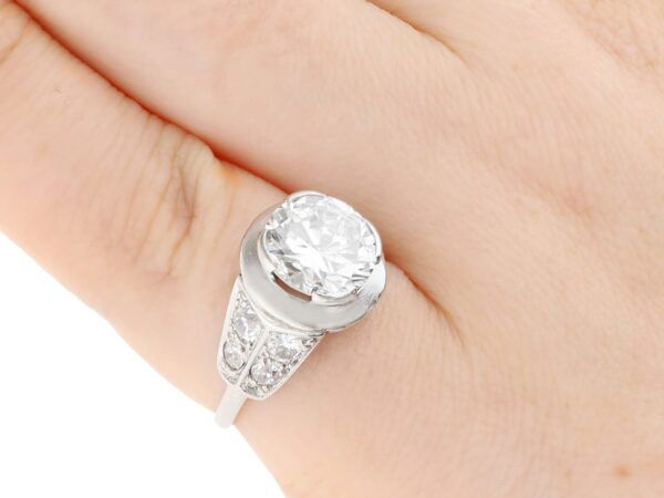2.70 carat round brilliant cut diamond ring on finger
