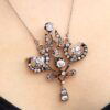 Edwardian diamond pendant brooch in gold on neck