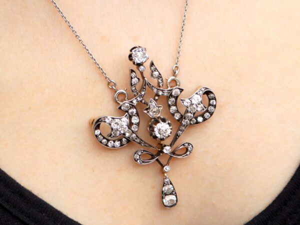 Edwardian diamond pendant brooch in gold on neck