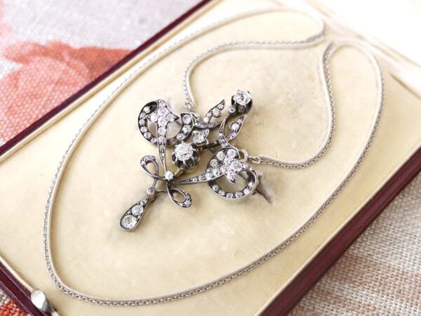 close up of Edwardian diamond pendant in box