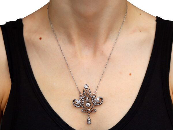 wearing Edwardian diamond pendant in gold