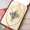 Edwardian diamond pendant brooch in gold with box open