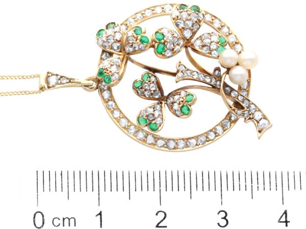 size of circular gold pendant with pearls and emeralds