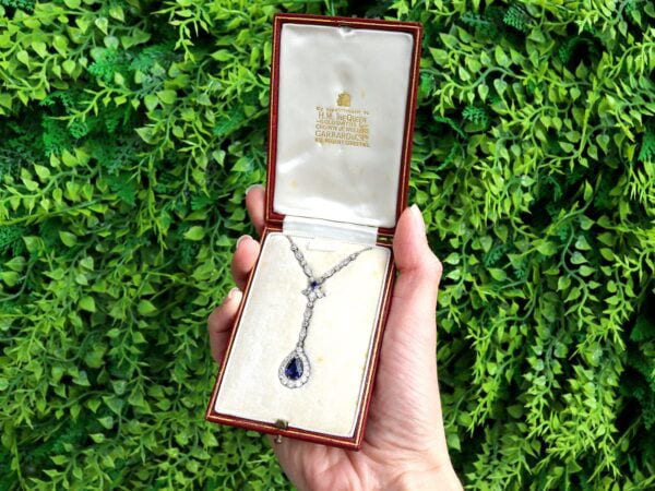 pear sapphire and diamond pendant in platinum outside