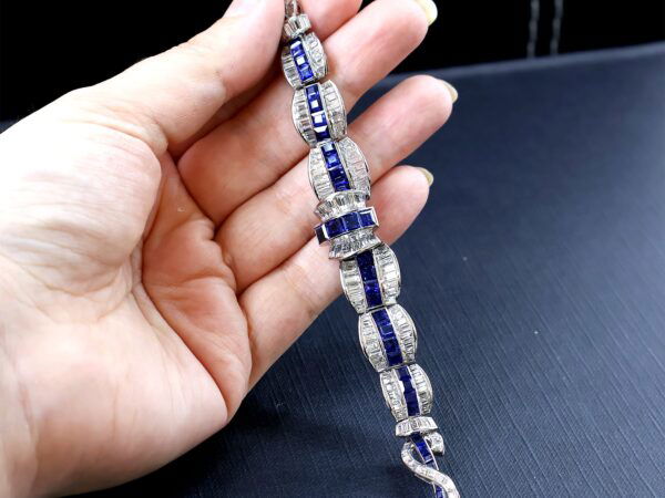 art deco sapphire necklace in hand