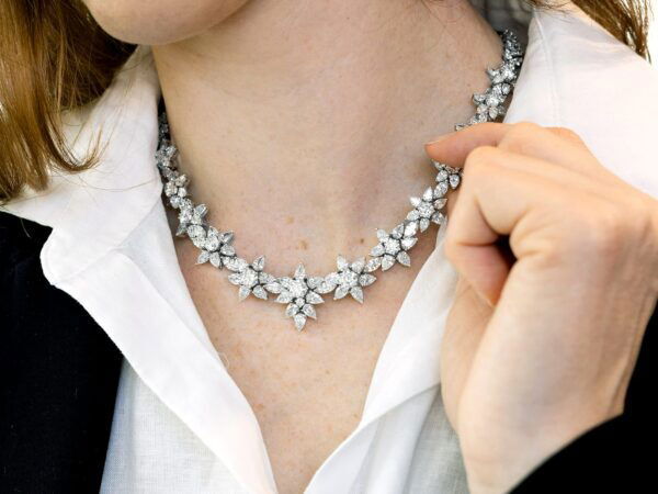 wearing a floral diamond necklace