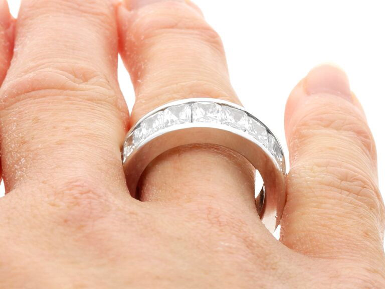 radiant cut diamond eternity ring on finger
